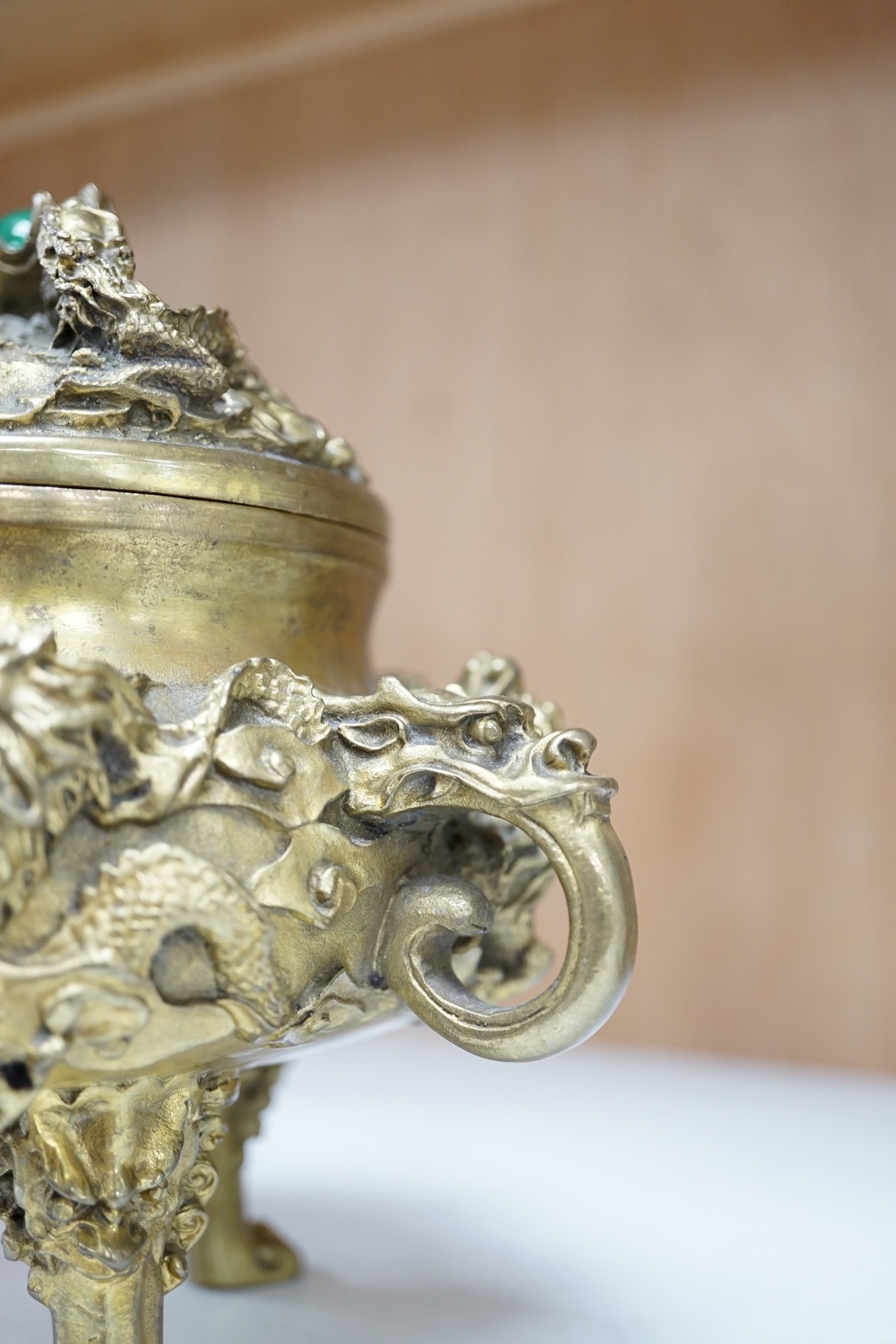 A Chinese bronze lidded censer, with jade bead insert in the finial, 15cm high. Condition - good.